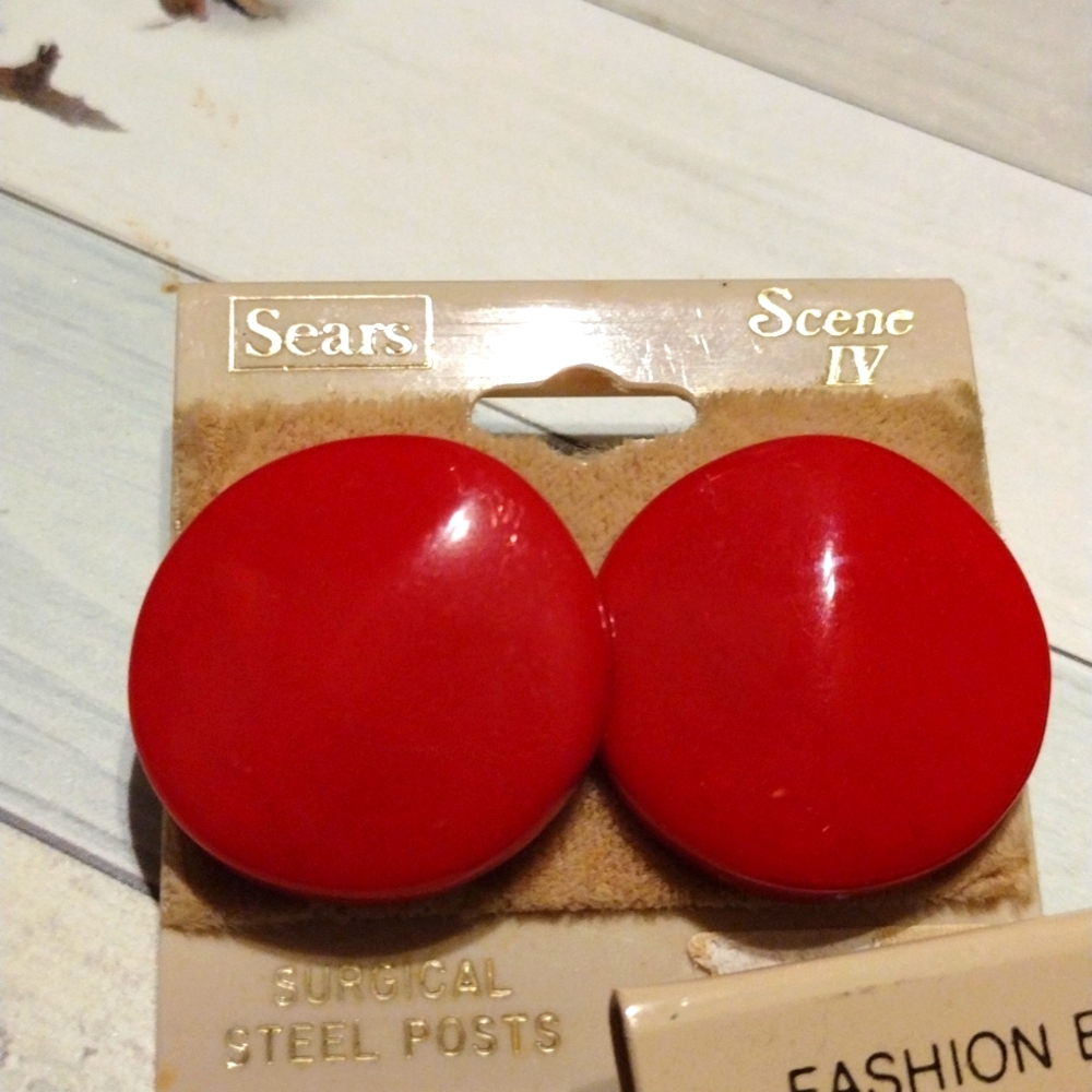 Red earrings about quarter sized with surgical steel posts.